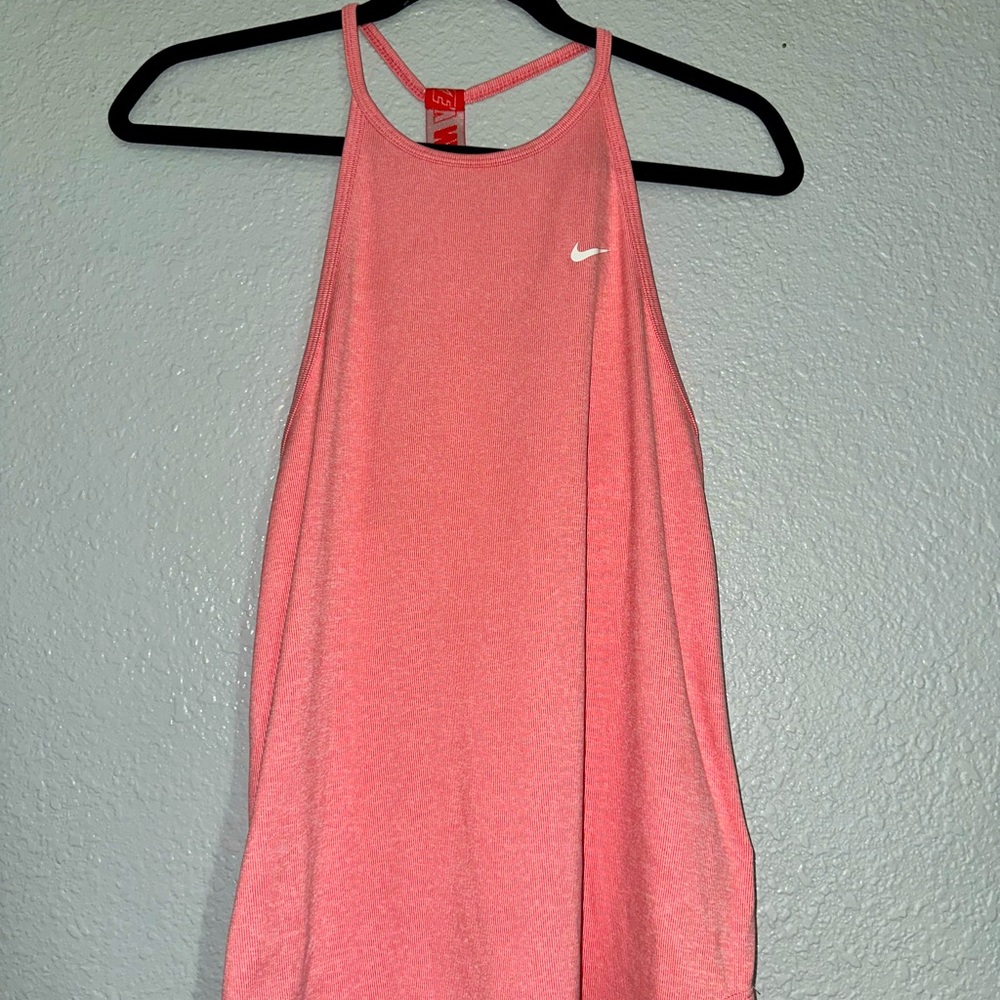 Brand is Nike. It is a athletic shirt. Size small.